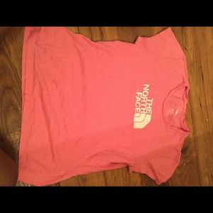 All pink north face shirt. Never worn.